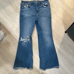 American Eagle Outfitters Blue Flare Jeans with Distressing and Raw Hem